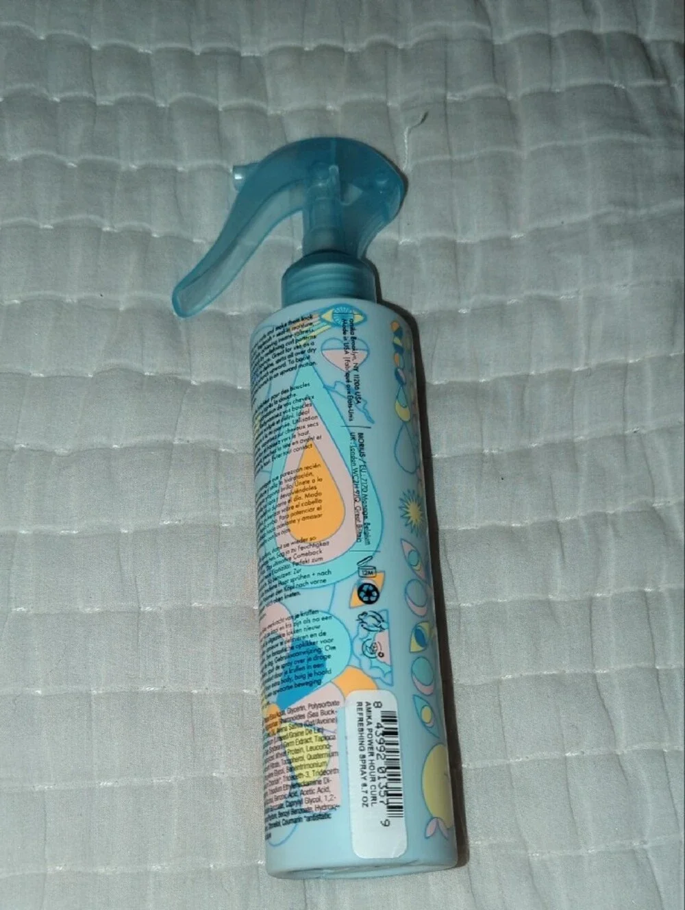 amika Power Hour Curl Refreshing Spray — blue and yellow bottle